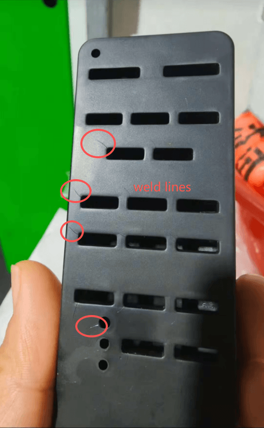 Before: visible weld line on part surface at flow-front convergence zone